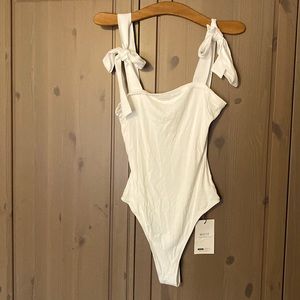 New with tags cream colored bodysuit